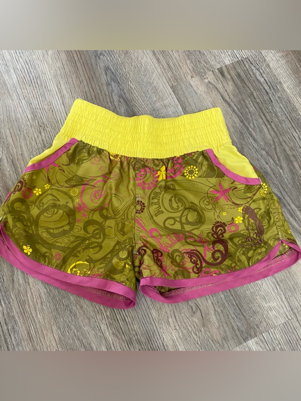 Hinano Tahiti Women's Yellow and Olive Floral Athletic Shorts with Pink Trim
